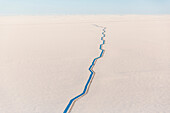 Aerial view of the Trans-Alaska Pipline passing over the snow covered tundra, Arctic Alaska, USA, Winter