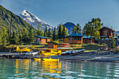 Two Super cub airplanes on Crescent Lake at Redoubt Mountain Lodge in Lake Clark National Park, Southcentral Alaska, summer