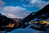 The first lights of sunrise on the village of Soglio. Bregaglia Valley Canton of Graub??nden Switzerland Europe