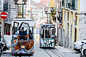 The characteristic trams proceed towards Bairro Alto a central district of the old city of Lisbon Portugal Europe