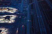 Aerial view of airplanes taxing on airport runway