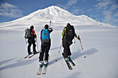 Skiers ascend the Northeast flanks of  Mt Augustine, a 4,025-foot high active volcano on Augustine Island in Cook Inlet, Alaska. The lava dome volcano is part of the Ring of Fire and last erupted in 2006.