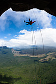 Climber ascends the fixed rope ,Acopan Tepui, Macizo de Chimanta, Venezuela.