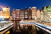 Amsterdam, houses reflecting on canal, Netherlands, Europe.