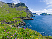 The coast near Gasadalur. The island Vagar, part of the Faroe Islands in the North Atlantic. Europe, Northern Europe, Denmark, Faroe Islands.