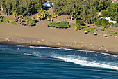 France, Reunion Island, Etang Sale les Bains, black sand beach (aerial view)