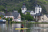 Canoeists on the Mosel in front of the old town of Treis-Karden, Eifel, Rheinland-Palatinate, Germany, Europe