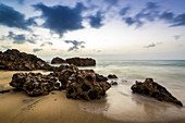 Rocks and stones on the beach Playa del Matorral at Morro Jable in the morning mood. Morro Jable, Fuerteventura, Canary Islands, Spain