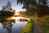 Moat at Raesfeld moated castle, Muensterland, North-Rhine Westphalia, Germany