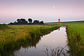 Pilsum lighthouse at full moon, near Greetsiel, East Friesland, Lower Saxony, Germany