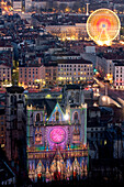 France, Rhone, Lyon, historical site listed as World Heritage by UNESCO, Fete des Lumieres (Light Festival), Saint Jean Cathedral and the big wheel of Place Bellecour