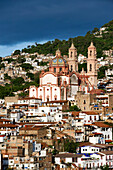 Mexico, Guerrero state, Taxco, the old city and Santa Prisca Cathedral, under a stormy sky