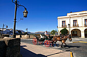 Spain, Andalusia, white village of Ronda, carriage on the puento Nuevo