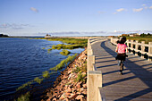 Canada, New Brunswick, the Acadian coast, Shippagan, the wodden promenade, young girl running