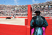 France, Gard, Nimes, horsemen during the bullfight for the Feria in the bullring