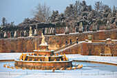 France, Yvelines, snow covered park of the Chateau de Versailles, listed as World Heritage by UNESCO, the Latona Basin