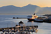 Norway, Troms County, Tromso harbour, the Coastal Express (Hurtigruten) in Tromsesundet Fjord