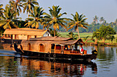 India, Kerala State, Allepey, the backwaters, houseboats (old transport barge converted for the touristic cruising of the canals)