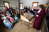 Canada, New Brunswick, the Acadian coast, the Acadian historic village of Caraquet, the school, teacher and her students