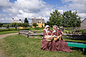 Canada, New Brunswick, Prince William, Kings Landing, living history village reenacting loyalist village from the beginning of the 19th century, young ladies in period costume