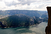 Norway, Rogaland County, Lysebotn Fjord, hikers in Preikestolen Rock at 600m above the Lysefjord