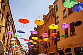 Multicolor umbrellas hanging outdoors, Bologna, Emilia-Romagna, Italy