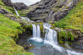 Small waterfall just outside the town of Grundarfjordur on the Snaefellsnes Peninsula, Iceland, Polar Regions