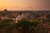 Hot air balloons at sunrise above Bagan (Pagan), Myanmar (Burma), Asia