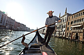 Gondolier on the Grand Canal, Venice, Italy