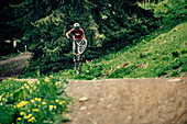 Bikepark Brandnertal, Brandnertal Valley, Mountainbiker, Downhill, Jump, Mountainbike, woods, gras, Vorarlberg, Austria, Mountains, Alps