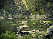 A man fishes in the Salmon River in Idaho.