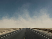 A road is covered with wind blown dust in Death Valley, California.