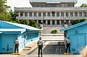 South Korean (ROK) soldiers  stand guard facing Notrh Korea.  This is the area where the leaders of the two countries gather and negotiate their differences.