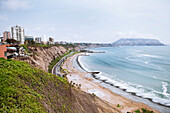 Perched high up on cliffs, the city of Lima, Peru faces the Pacific Ocean.