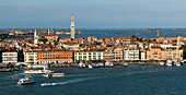 Cityscape of Venice with towers along the skyline and boats in the canal, Venice, Italy