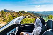 women with a convertible in the mountains near Arta, Mallorca, Balearic Islands, Spain