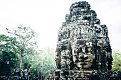 Dilapidated statue and pillar at Angkor Wat, Siem Reap, Cambodia