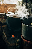 Close up of steamy pot cooking on stove