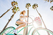 Caucasian woman riding bicycle