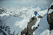 Young male skier jumping down a snowdrift in the mountains, Gudauri, Mtskheta-Mtianeti, Georgia