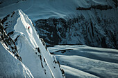 Young male skier riding apart the slopes through the deep powder snow, Gudauri, Mtskheta-Mtianeti, Georgia