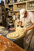 pastry for focaccia being made in restaurant Tortuga, Genoa, Liguria, Italy
