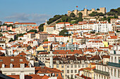view across city to hilltop with Sao Jorge Castle, Lisbon, Portugal