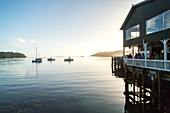 anchored boats, sunset, wharf, Halfmoon Bay, Stewart Island, Rakiura, New Zealand