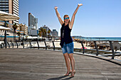 Woman on the Tayelet (beach promenade), Tel-Aviv, Israel