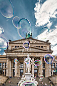 Soap bubbles in front of the concert hall Gendarmenmarkt, Berlin, Germany