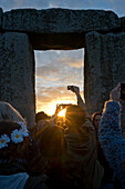 Revellers gather at historic monument for Summer Solstice celebrations on 21 June 2016, Stonehenge, UNESCO World Heritage Site, Wiltshire, England, United Kingdom, Europe