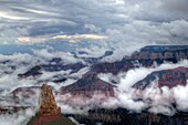 Fog lifts from the Bottom of The Grand Canyon from Point Imperial at Grand Canyon National Park, Arizona.