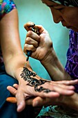 Fes, Marocco, North Africa. Henna tattoo on hand for a tourist.