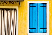 Burano, Venice, Veneto, North East Italy, Europe. Colored facade in Burano.